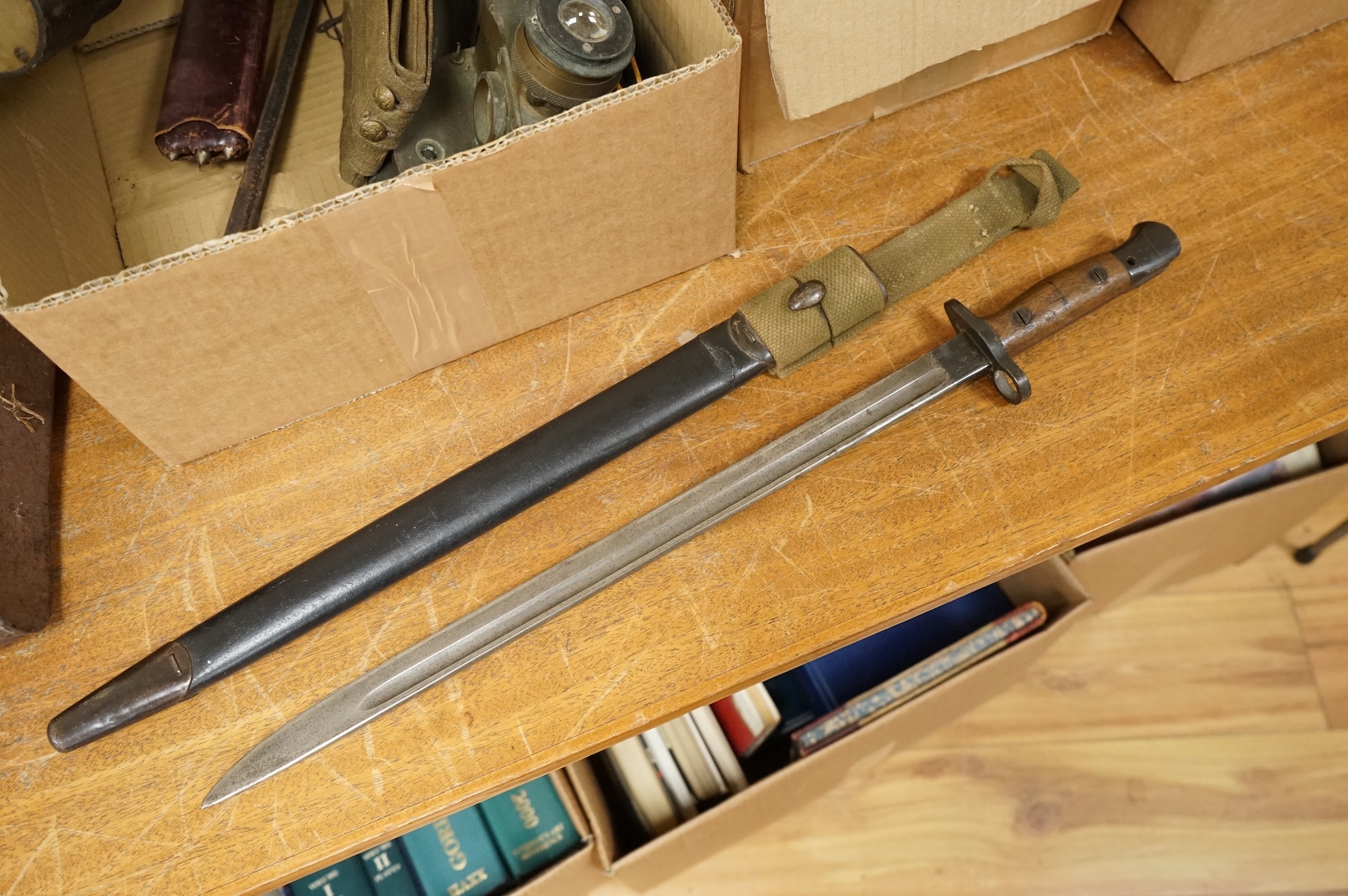 A collection of militaria including; a US Air Force camera Type N-6, a leather cased Bell & Howell Sportster camera and accessories, a pair of periscope binoculars, a leather cased compass by Goerz, Berlin